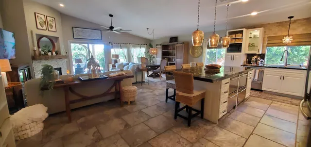 a kitchen with cabinets and window