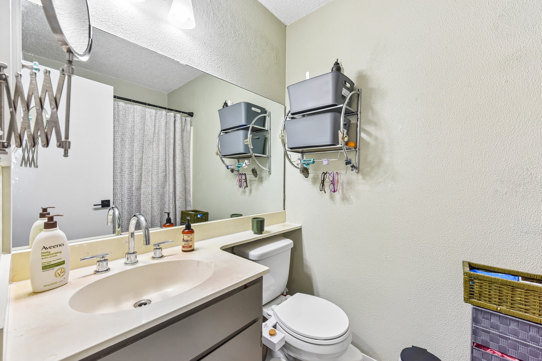 9610 Covey Ridge Lane Austin, TX 78758 - Photo 13 of 22 Bathroom vanity featuring an integrated oval sink and a light-colored countertop