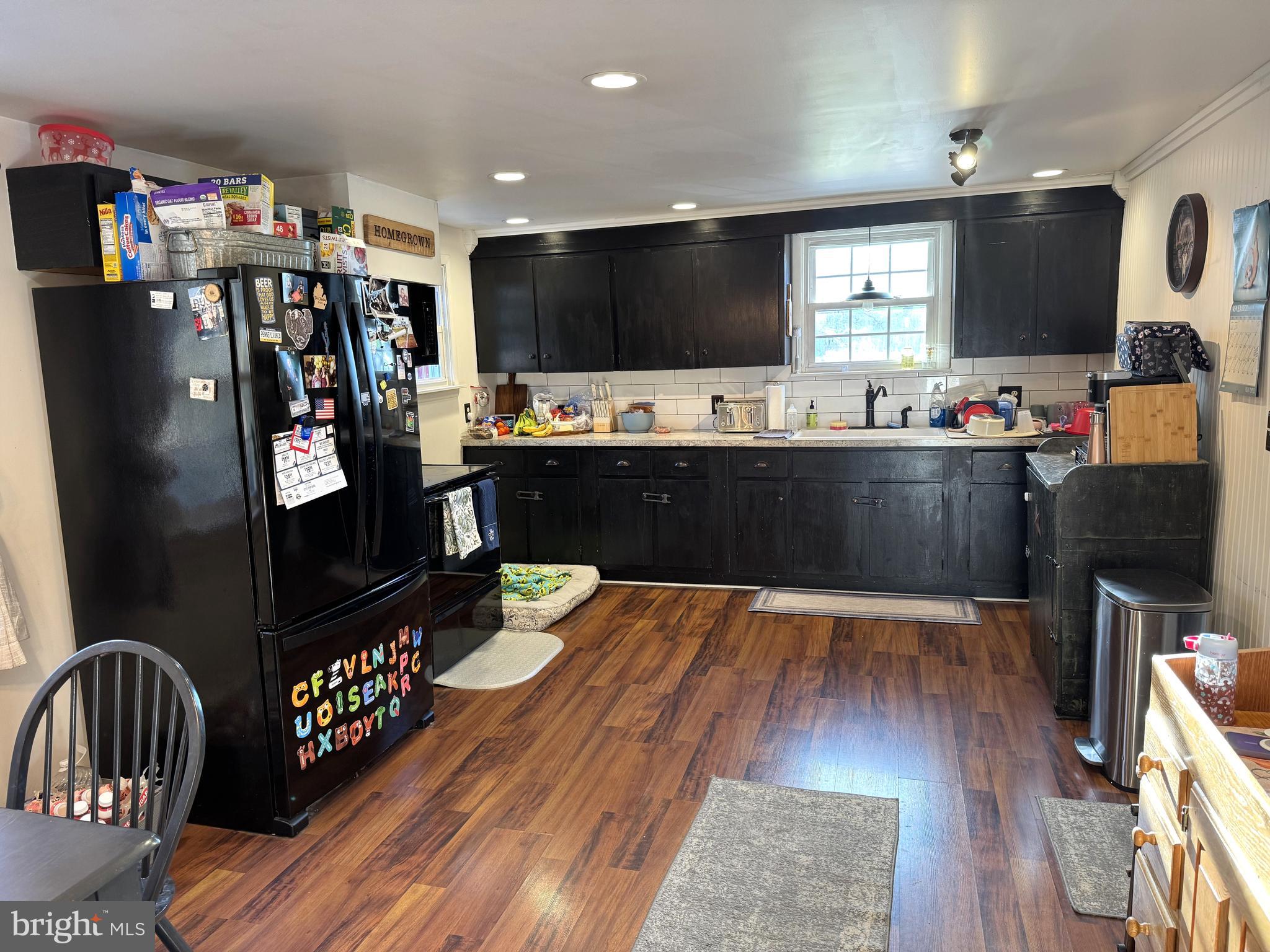 1792 Back Maitland Road Lewistown, PA 17044 - Photo 3 of 31 a kitchen with stainless steel appliances kitchen island granite countertop a refrigerator dining table and chairs