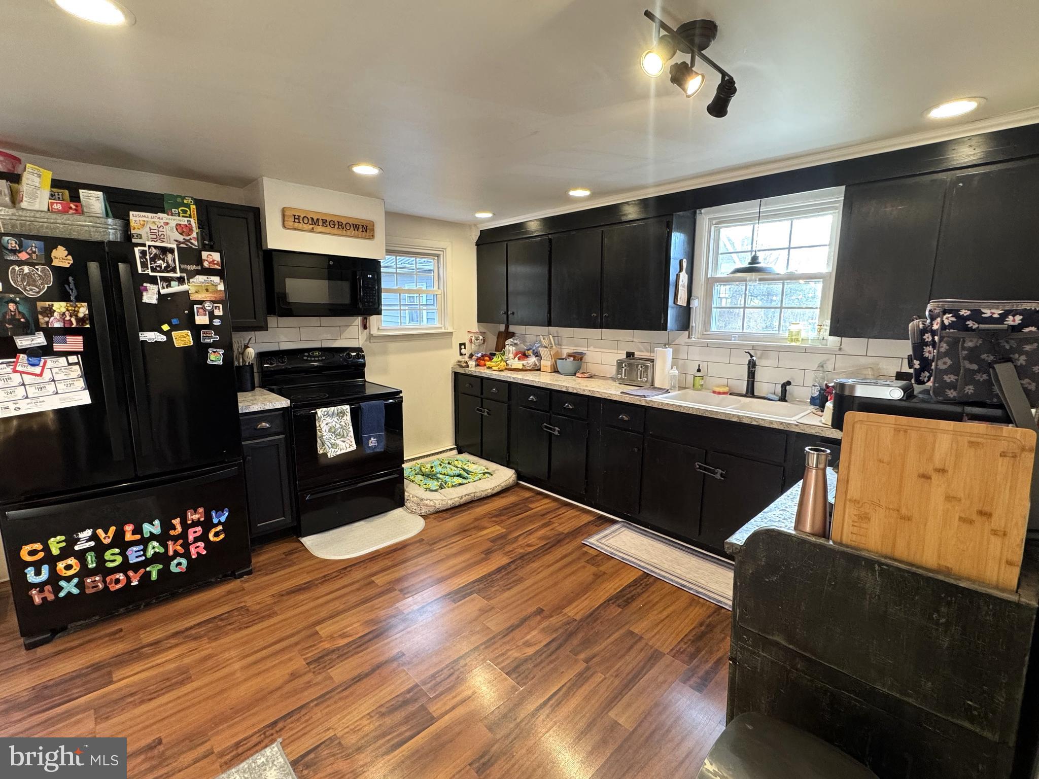 1792 Back Maitland Road Lewistown, PA 17044 - Photo 4 of 31 a large kitchen with stainless steel appliances granite countertop a sink dishwasher a stove and a refrigerator with wooden floor