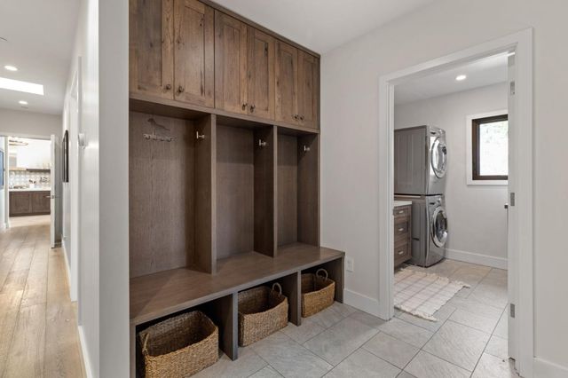 a spacious bedroom with a bed and a dresser