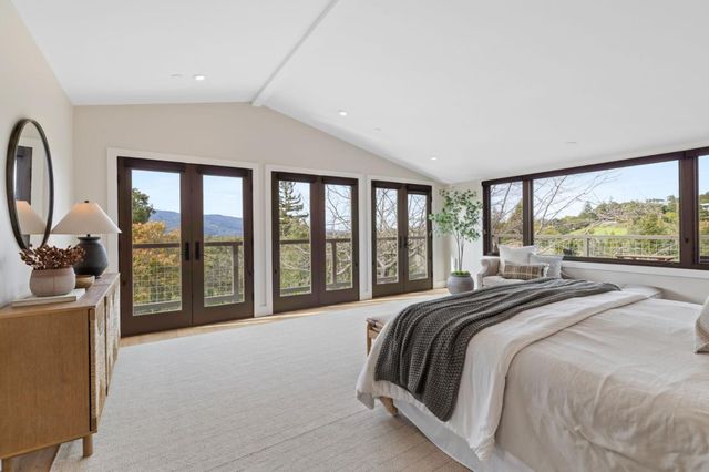 a spacious bathroom with a double vanity sink and a mirror