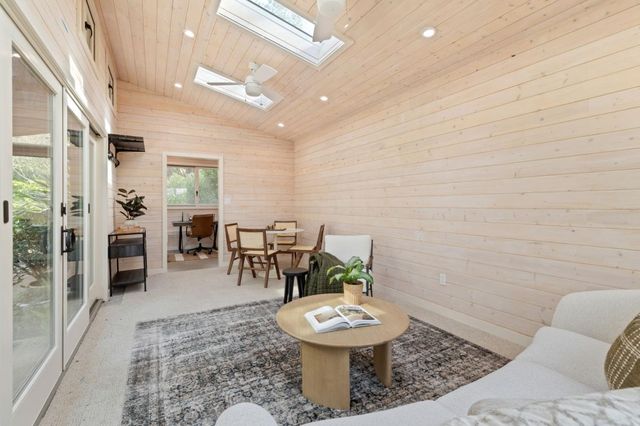 an aerial view of a house with a big yard