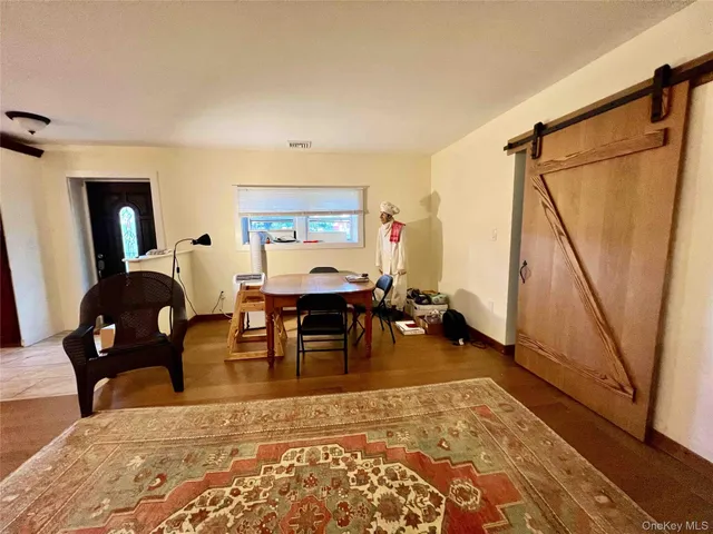 a kitchen with stainless steel appliances kitchen island granite countertop a stove a sink and a refrigerator