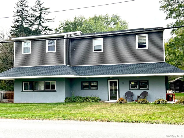 a living room with furniture and a rug