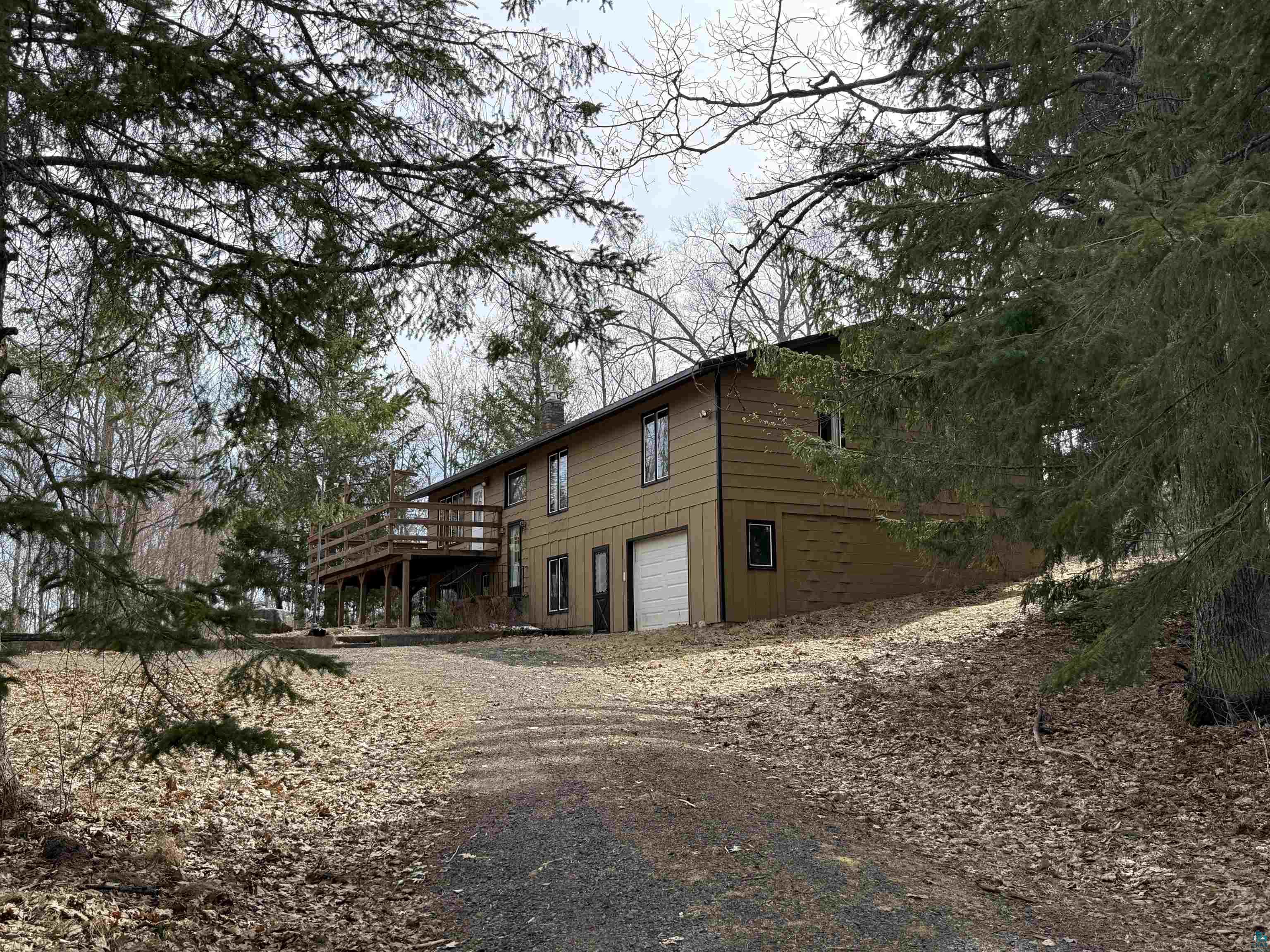 9410 Pine Lake Road Iron River, WI 54847 - Photo 3 of 31 Two-story residence with a tan exterior siding and multiple windows
