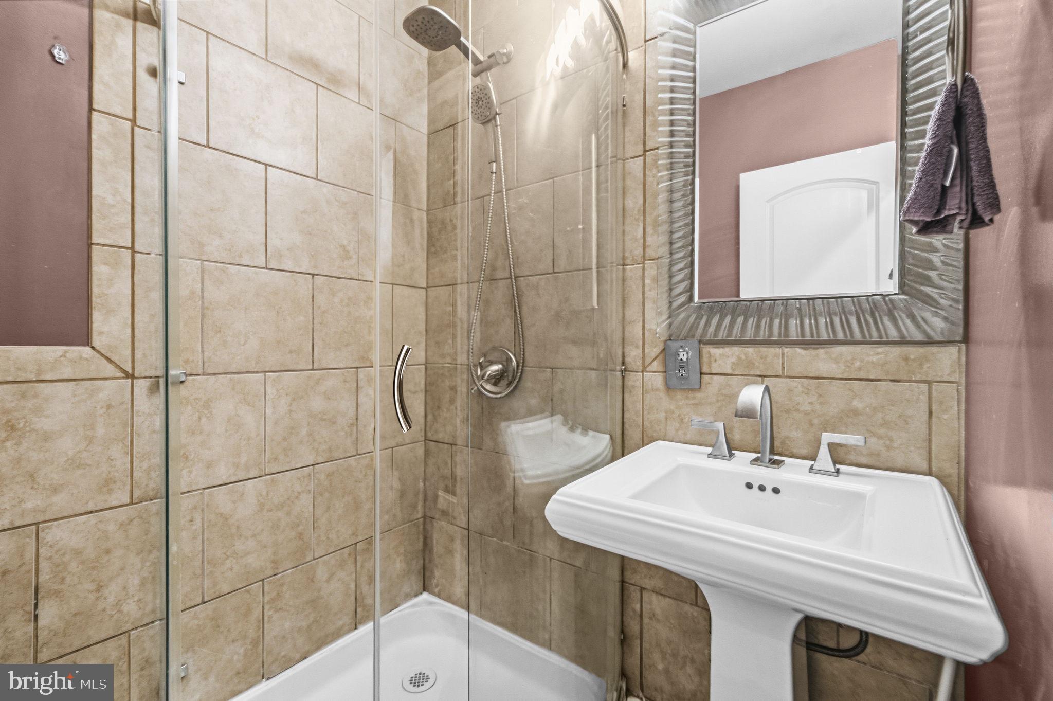 1824 3rd Street Northeast Washington, DC 20002 - Photo 15 of 30 Sleek modern bathroom with elegant tiles.