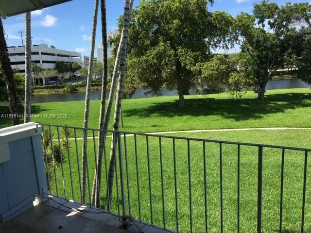 7580 Southwest 82nd Street, Unit F214 Miami, FL 33143 - Photo 12 of 13 a view of a balcony with a garden