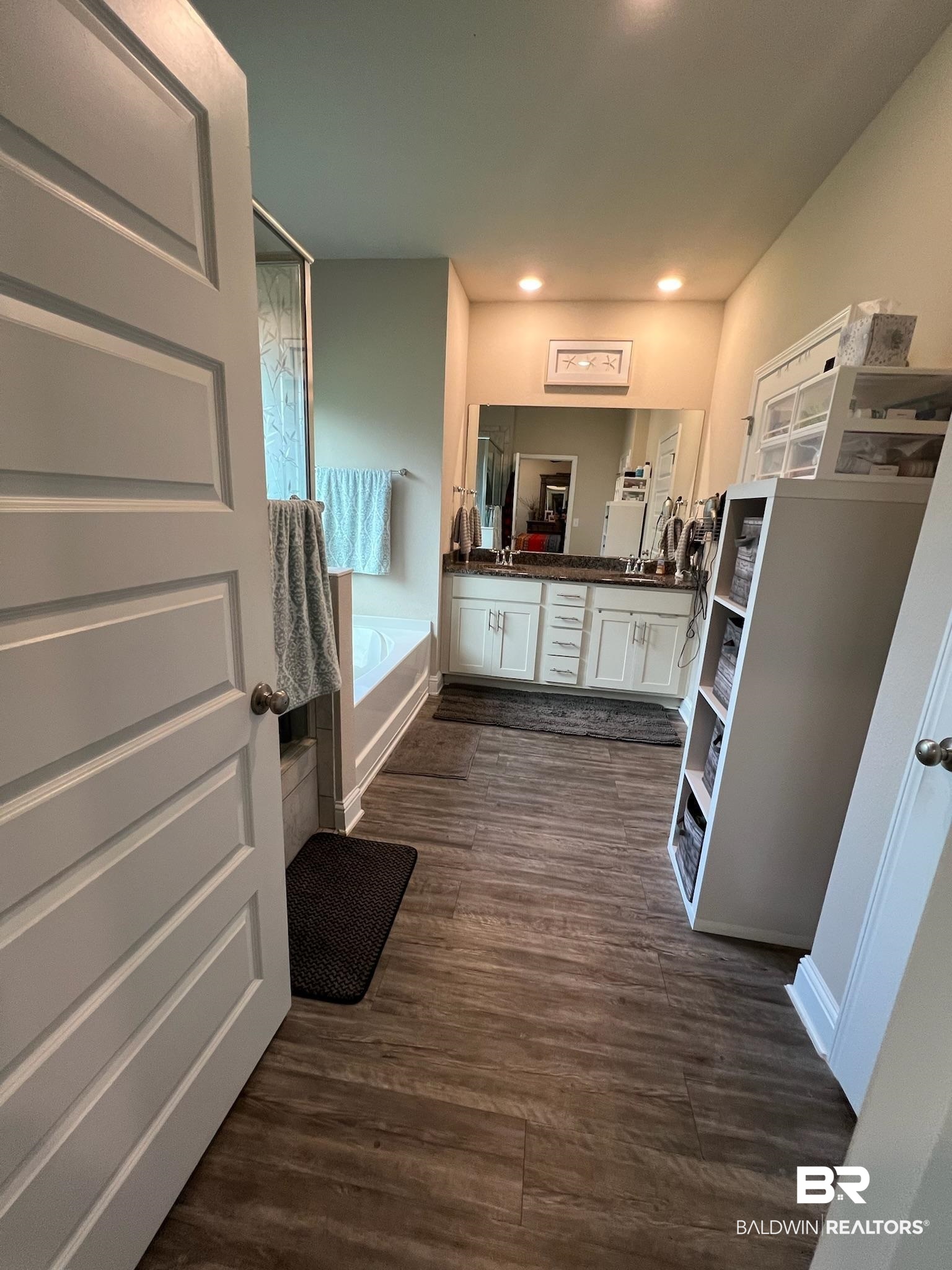 3904 Conrad Court Gulf Shores, AL 36542 - Photo 15 of 24 Interior space featuring hardwood / wood-style floors, vanity, and a bath