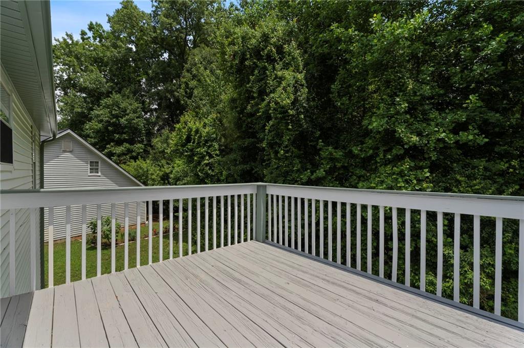 3602 Bristol Overlook Rex, GA 30273 - Photo 23 of 37 a balcony with wooden floor and fence