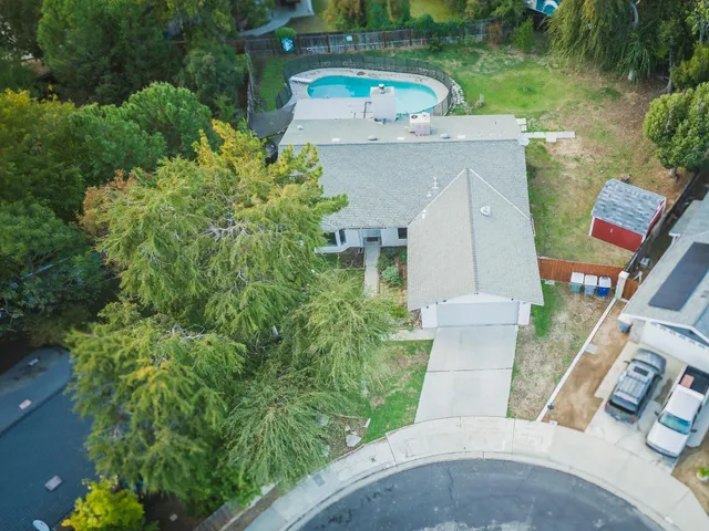 an aerial view of a house with a garden