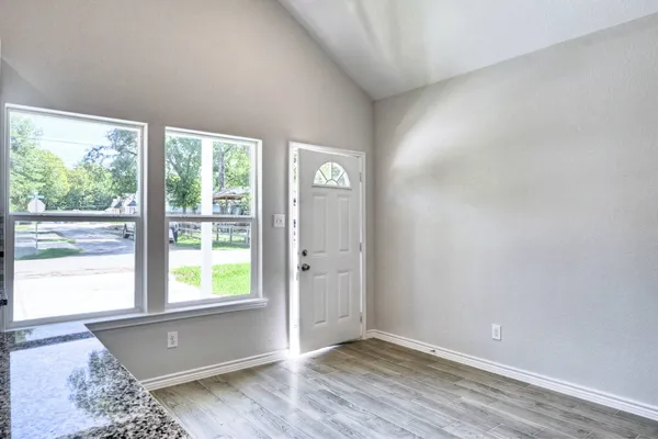 a view of an empty room with a window