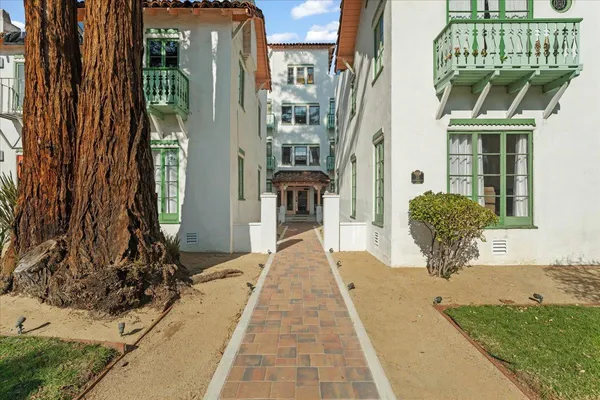 a swimming pool with barbeque oven outdoor seating and yard