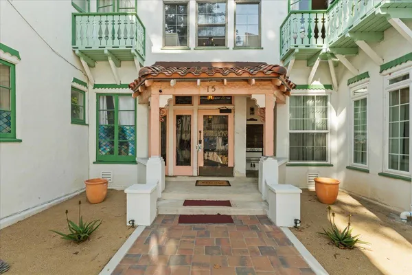 a front view of a building with outdoor seating