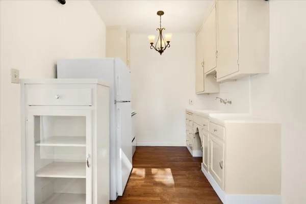 a bathroom with a sink a vanity and a mirror