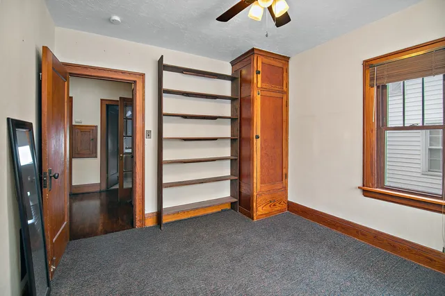 a view of empty room with ceiling fan