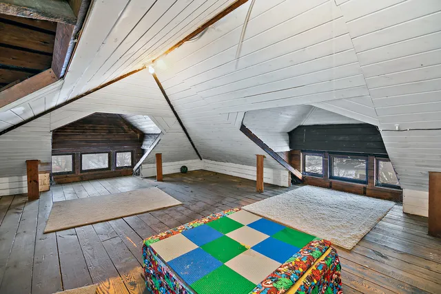 a view of an empty room with windows