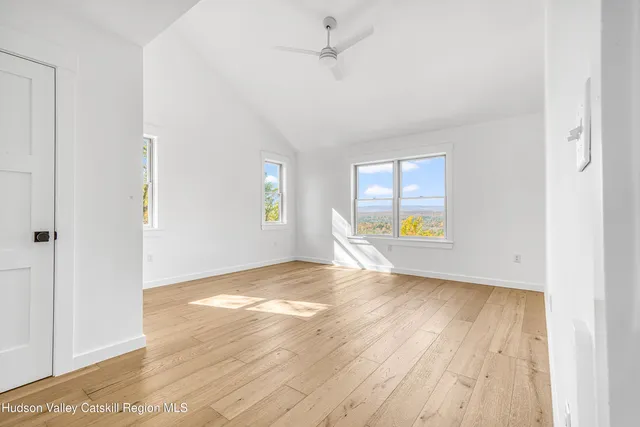 a view of balcony with wooden floor