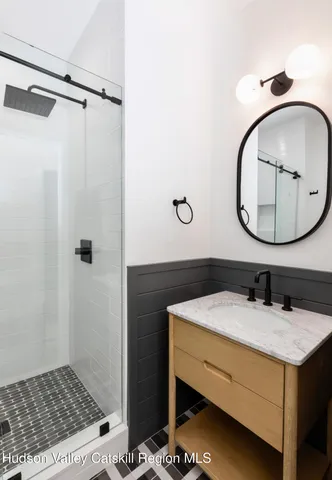 a view of a house with a snow in the background