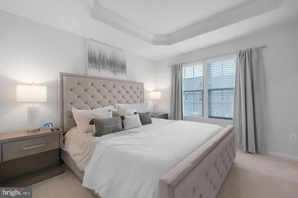 a bedroom with double bed and a window