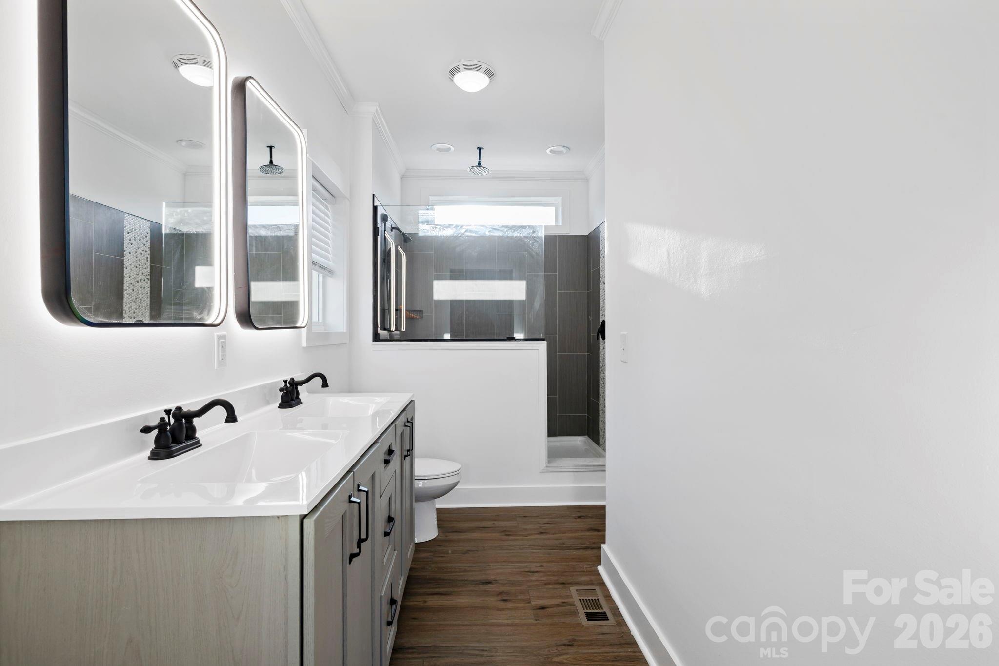 203 Southern Charm Road Arden, NC 28704 - Photo 15 of 34 a bathroom with a sink and a mirror