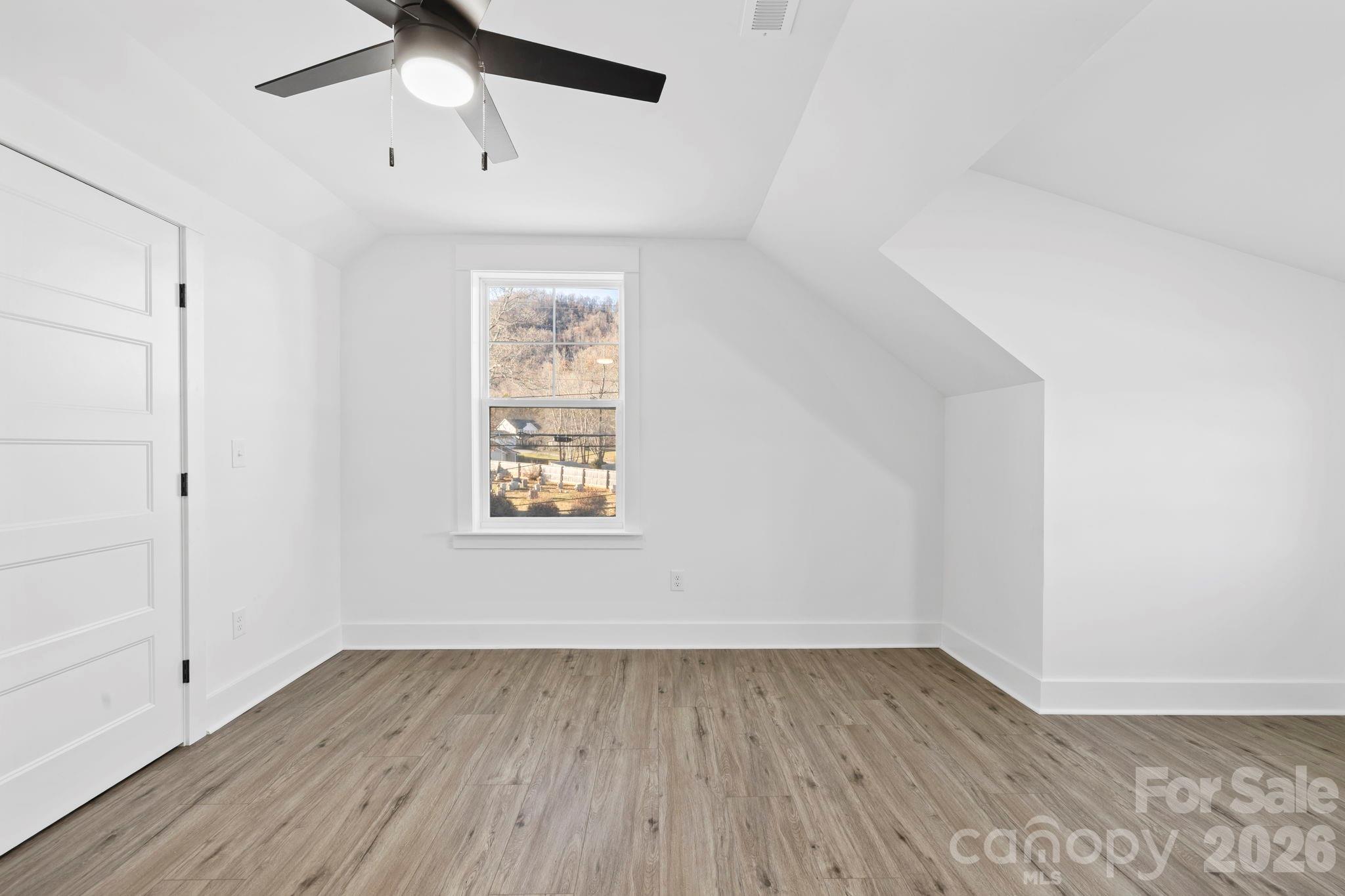 203 Southern Charm Road Arden, NC 28704 - Photo 21 of 34 wooden floor in an empty room with a window