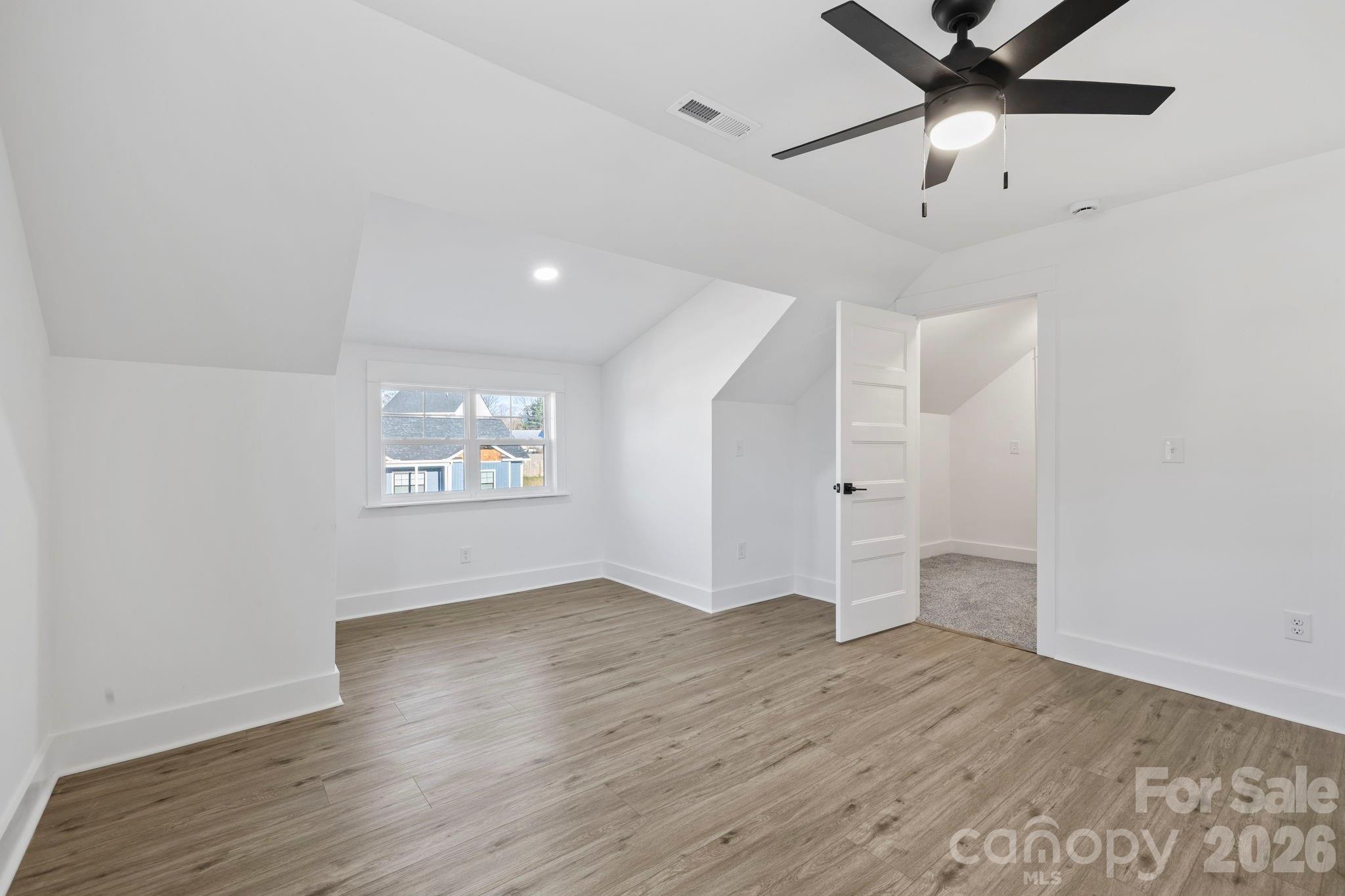 203 Southern Charm Road Arden, NC 28704 - Photo 23 of 34 wooden floor in an empty room with a window