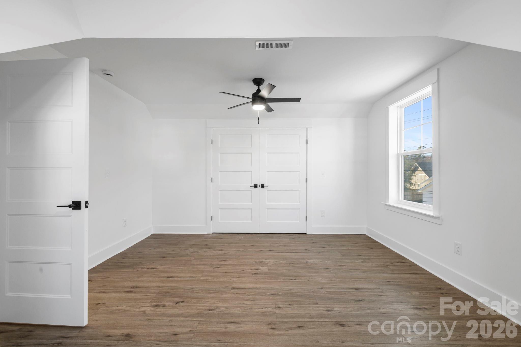 203 Southern Charm Road Arden, NC 28704 - Photo 24 of 34 an empty room with fan and windows