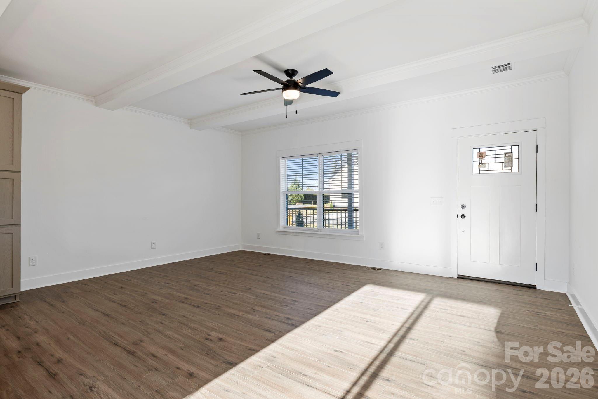 203 Southern Charm Road Arden, NC 28704 - Photo 6 of 34 wooden floor in an empty room with a window