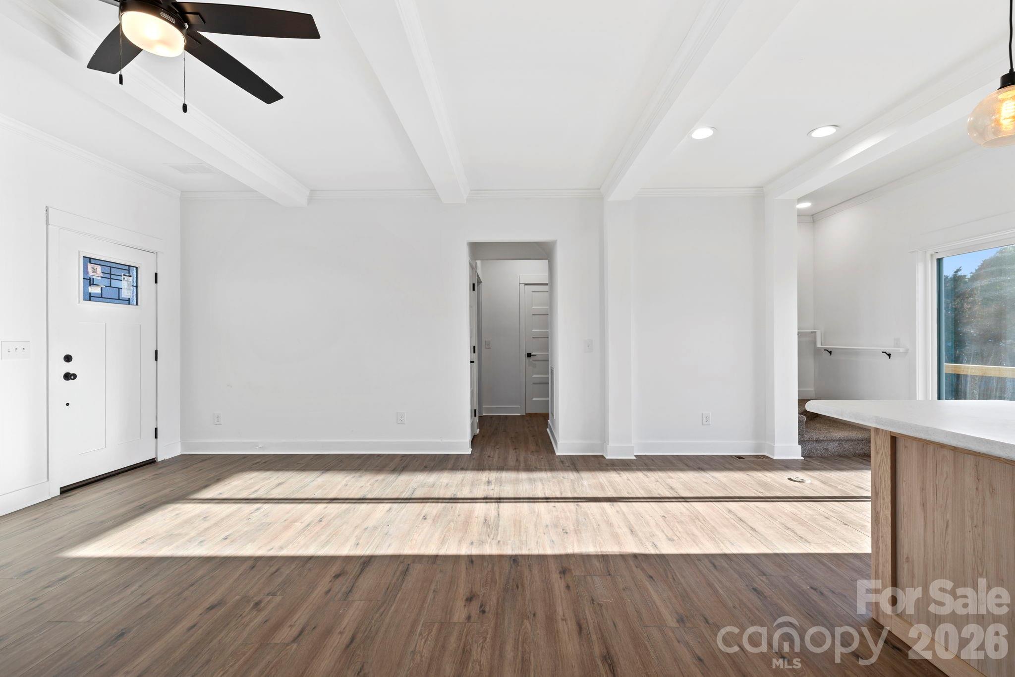 203 Southern Charm Road Arden, NC 28704 - Photo 8 of 34 a view of an empty room with wooden floor