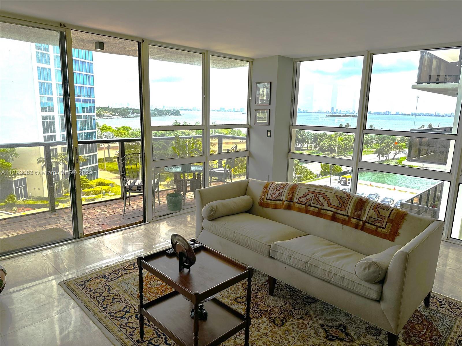 600 Northeast 36th Street, Unit 701 Miami, FL 33137 - Photo 1 of 19 a living room with furniture and a large window