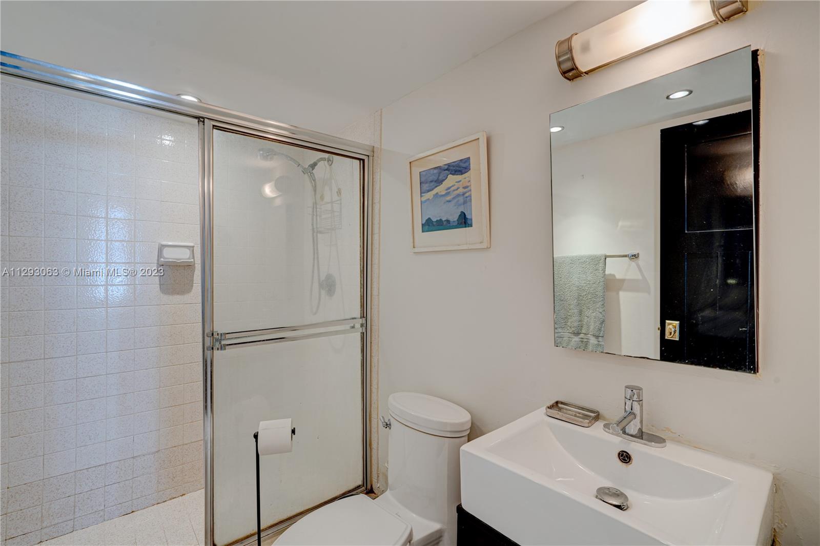 600 Northeast 36th Street, Unit 701 Miami, FL 33137 - Photo 15 of 19 a bathroom with a sink toilet and shower
