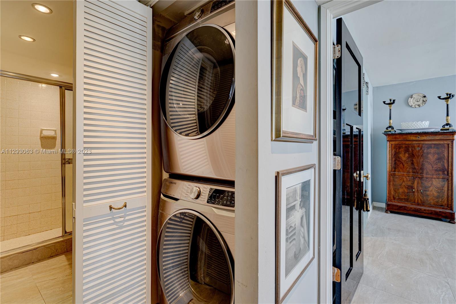 600 Northeast 36th Street, Unit 701 Miami, FL 33137 - Photo 17 of 19 a view of a hallway with washer and dryer