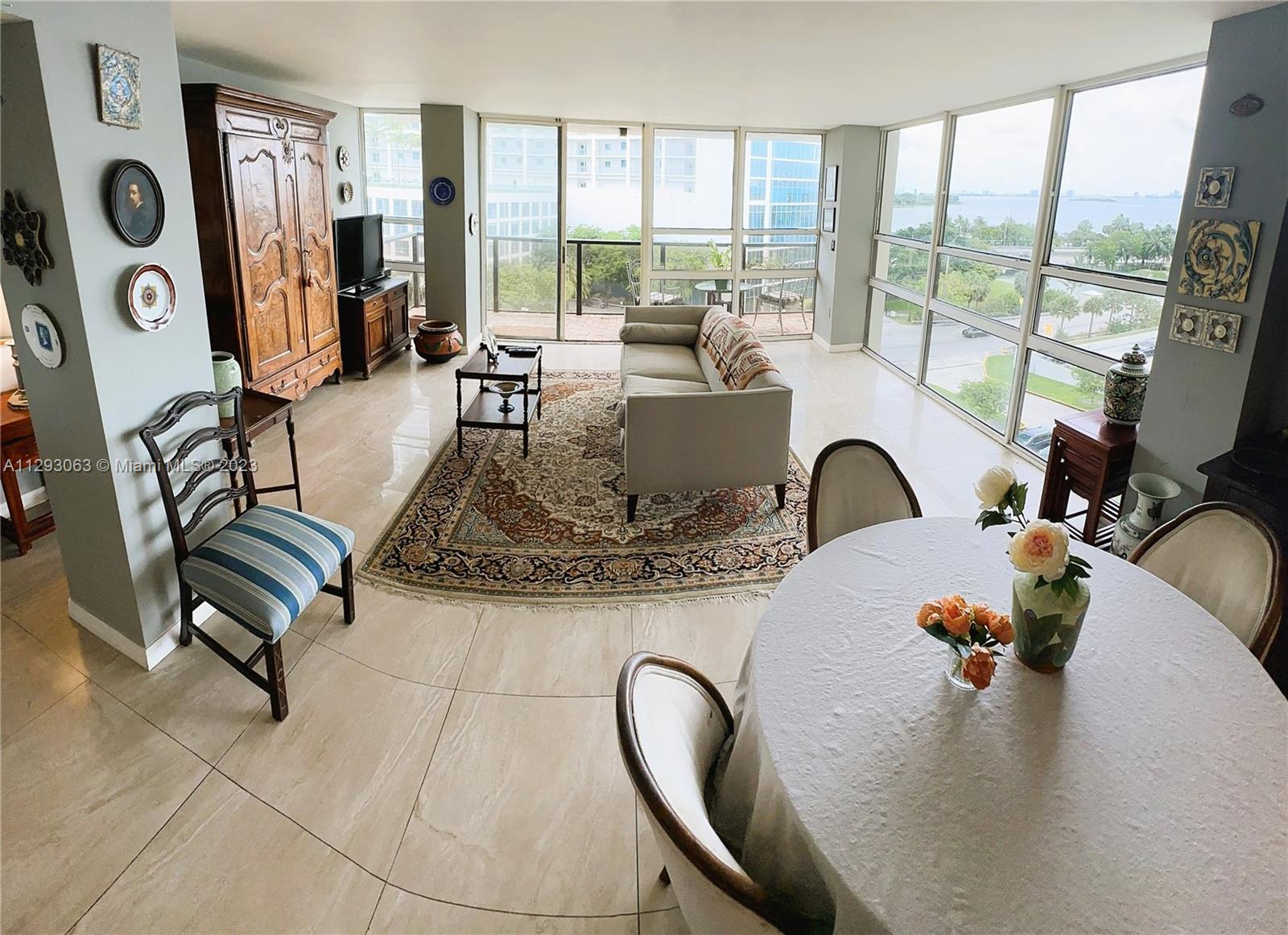 600 Northeast 36th Street, Unit 701 Miami, FL 33137 - Photo 2 of 19 a view of a dining room with furniture window and outside view