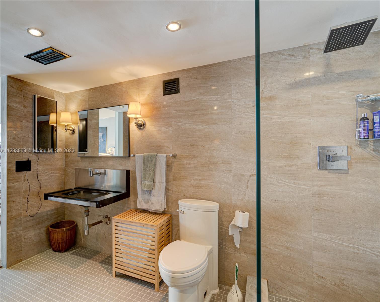 600 Northeast 36th Street, Unit 701 Miami, FL 33137 - Photo 10 of 19 a bathroom with a granite countertop toilet sink and mirror
