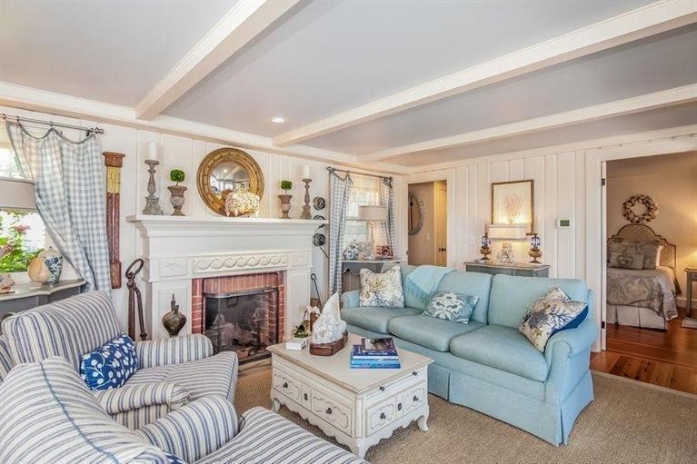 13 Quinn Road Orleans, MA 02653 - Photo 6 of 18 a living room with furniture and a fireplace