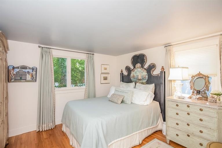 13 Quinn Road Orleans, MA 02653 - Photo 8 of 18 a bedroom with a bed and a dresser with wooden floor