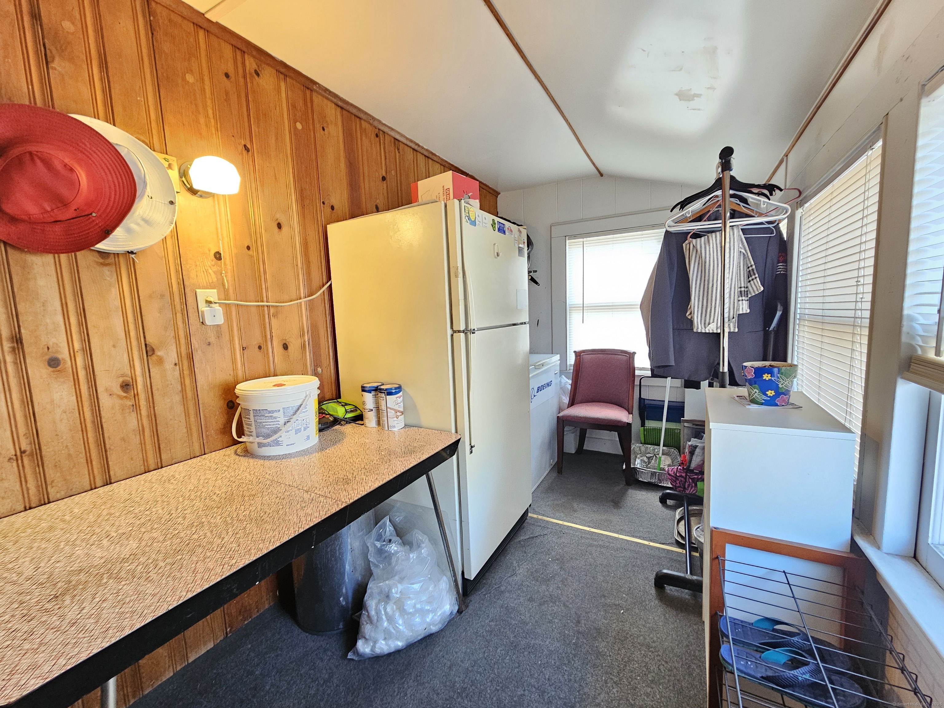 42 Washington Street Wallingford, CT 06492 - Photo 14 of 15 a room with furniture a rug and a window