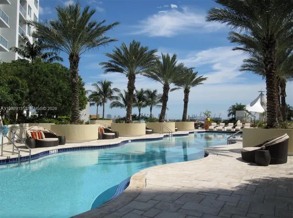 a view of a swimming pool and lounge chair