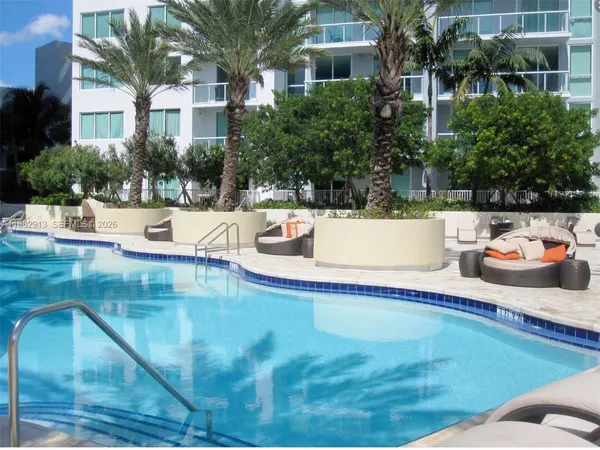 a view of a swimming pool with a patio