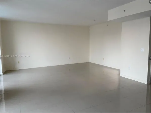 a bathroom with a granite countertop toilet and a bathtub