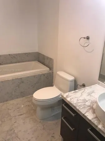 a view of a bathroom with toilet
