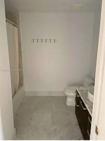 a vase of flowers sitting on a table with painted walls