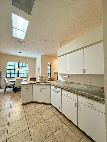 a kitchen with a sink and cabinets