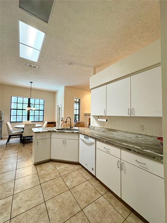 7964 Roundelay Drive New Port Richey, FL 34654 - Photo 11 of 27 a kitchen with a sink and cabinets