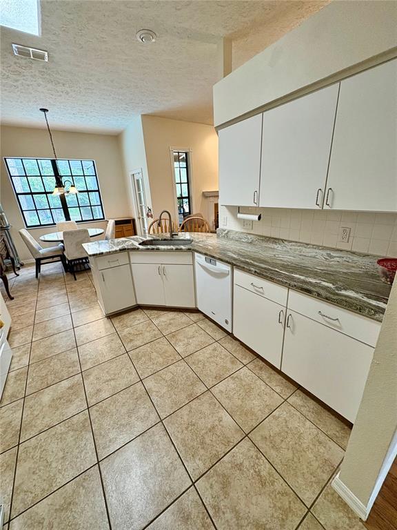 7964 Roundelay Drive New Port Richey, FL 34654 - Photo 12 of 27 a kitchen with a sink and a stove top oven