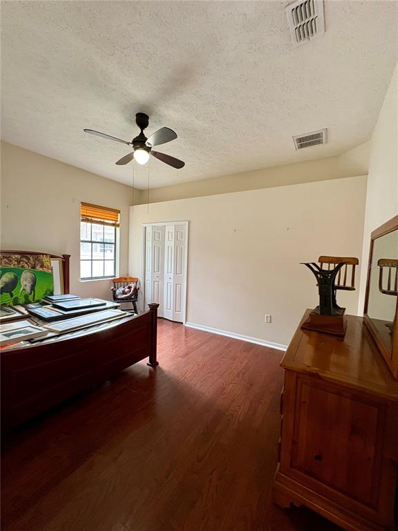 7964 Roundelay Drive New Port Richey, FL 34654 - Photo 14 of 27 a living room with furniture and a chandelier