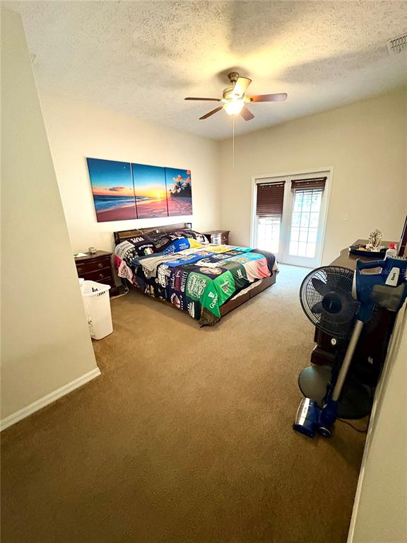 7964 Roundelay Drive New Port Richey, FL 34654 - Photo 17 of 27 a bedroom with bed and gym equipment