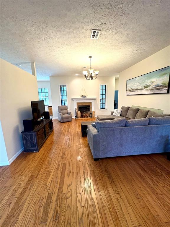 7964 Roundelay Drive New Port Richey, FL 34654 - Photo 4 of 27 a living room with furniture and a wooden floor