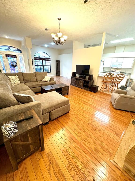 7964 Roundelay Drive New Port Richey, FL 34654 - Photo 6 of 27 a living room with furniture and a wooden floor